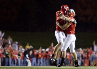 Nighttime picture of celebrating college football players at Rutgers University. Photo ©Suzy Allman.