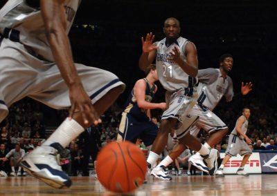 low angle basketball with men's university basketball team at the Big East Tournament, pitting Syracuse against Georgetown at Madison Square Garden. Photo by Suzy Allman