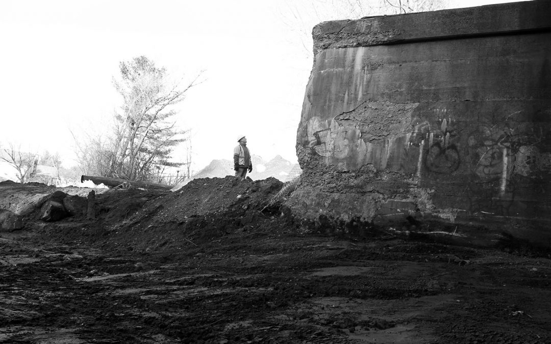 Black and white image of construction engineer at the Tel-Electric Dam in Pittsfield, Massachusetts