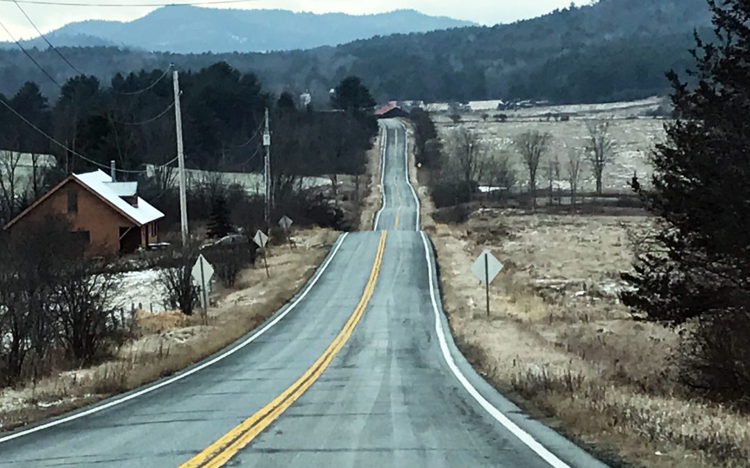 A road in winter along a country valley