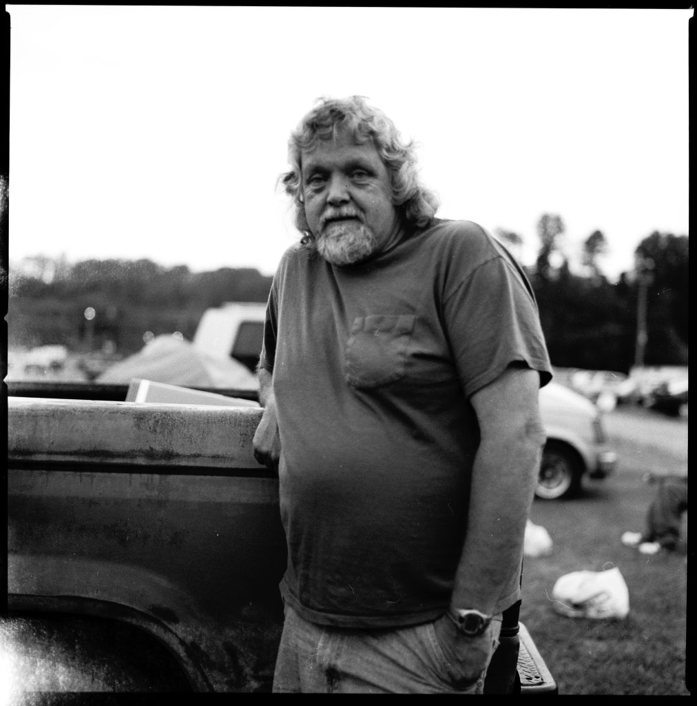 black and white photo of man in t-shirt in appalachia