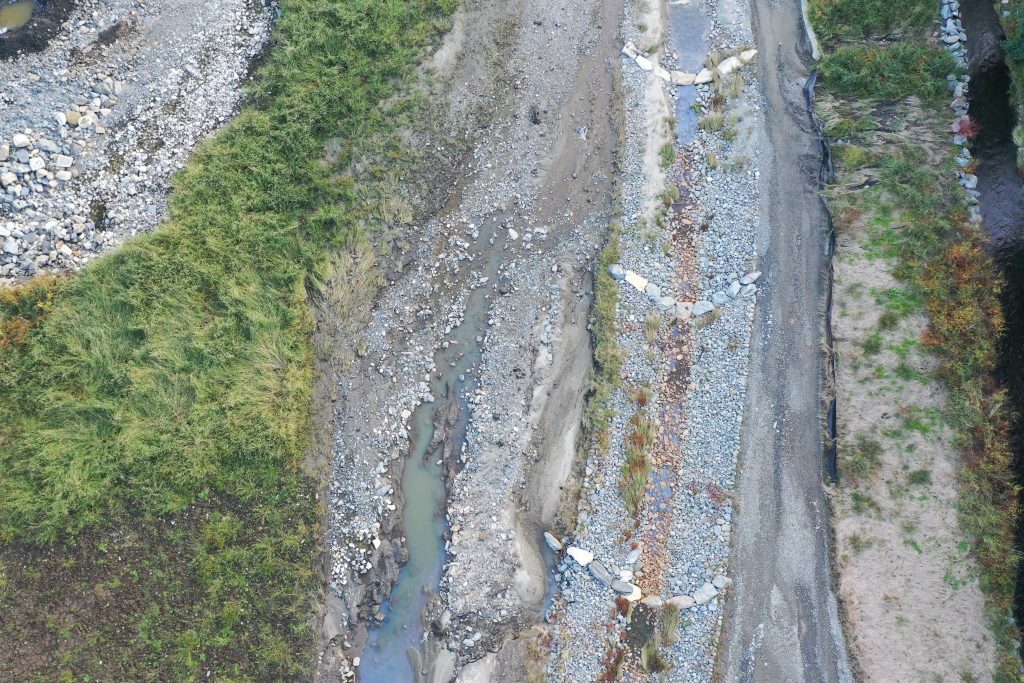 Riffle control structures in stone installed in the Saw Mill River at the former Woodlands Lake site in Ardsley, New York.